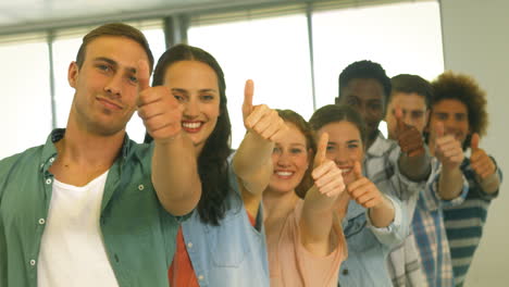 students showing thumbs up together