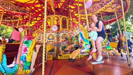 colorful carousel with joyful riders in london