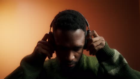 man listening to music with headphones