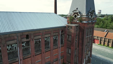 Forward-Arc-Around-Majestic-Abandoned-Building-With-Clock-Tower-in-Ghent