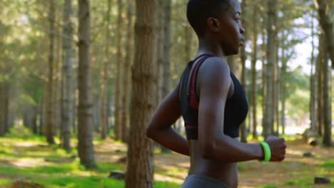 woman jogging in the forest 4k