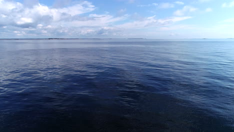 drone moving over the blue sea