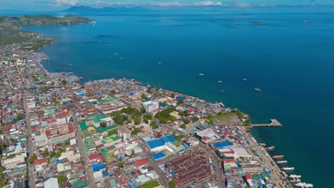 aerial view of the crystal blue waters by the vibrant city of surigao