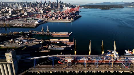 vancouver, british columbia, canada - a broad landscape of centennial terminals on burrard inlet - drone flying forward