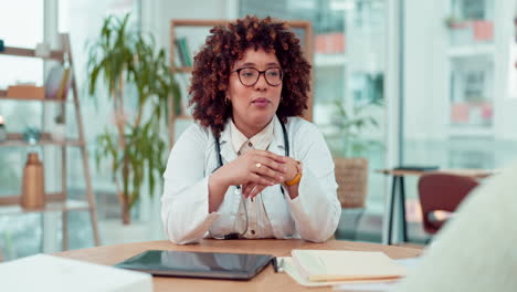 woman doctor talking to patient in office