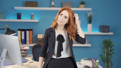businesswoman tiredly scratching her head.