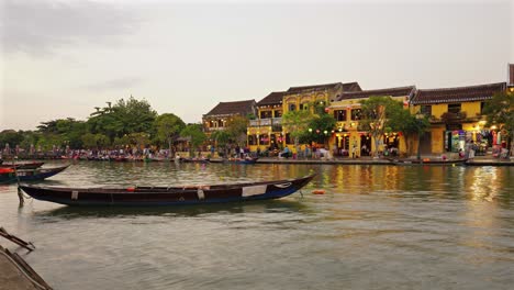 hoi an ancient town at night: boats, lanterns, and tourists