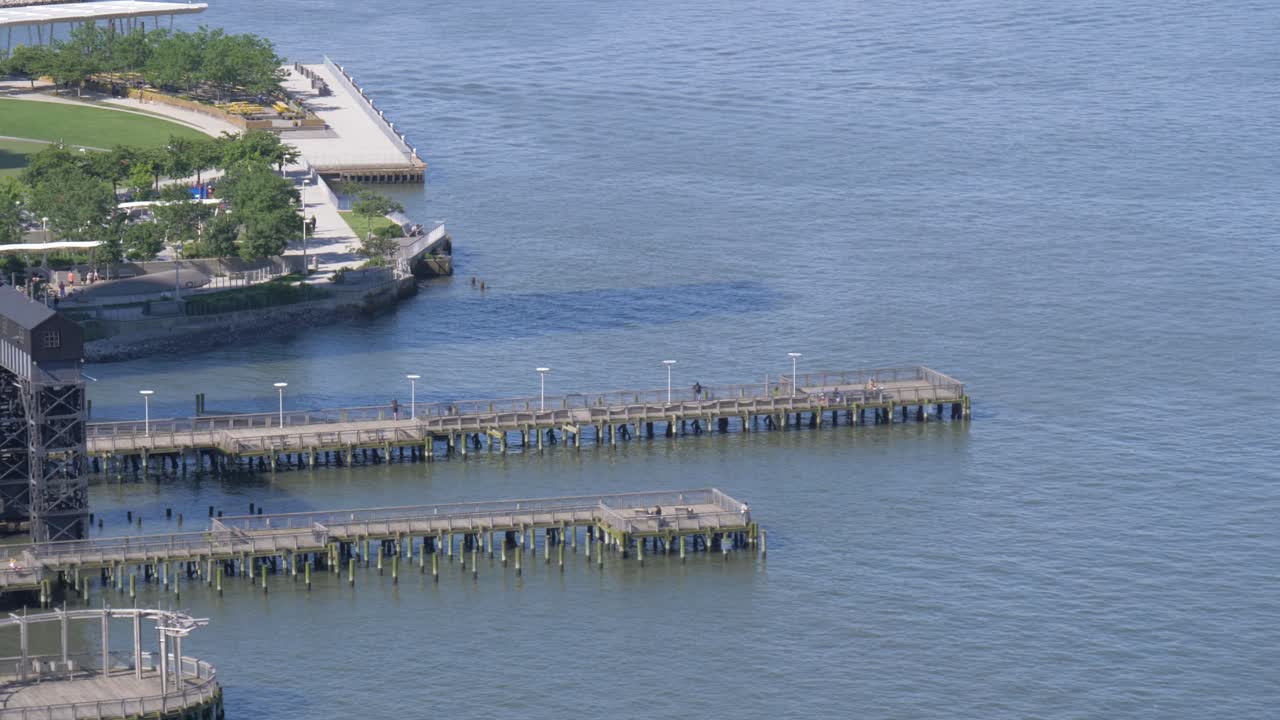 Piers over East River at Gentry Plaza State Park, Long Island City, Queens, New York City