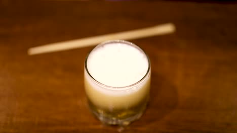 beer being poured into a glass