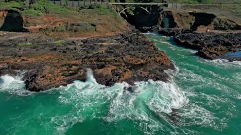 Located-in-the-Cape-Perpetua-Scenic-Area,-just-three-miles-south-of-Yachats-Oregon,-Thor's-Well-is-a-bowl-shaped-hole-carved-out-of-the-rough-basalt-shoreline