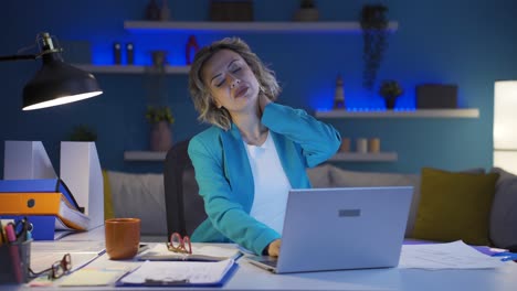 home office worker woman has neck pain.
