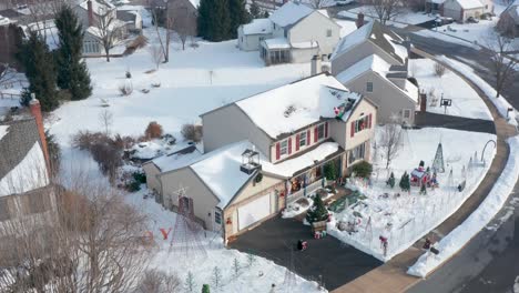 descending aerial approaches large christmas lawn display