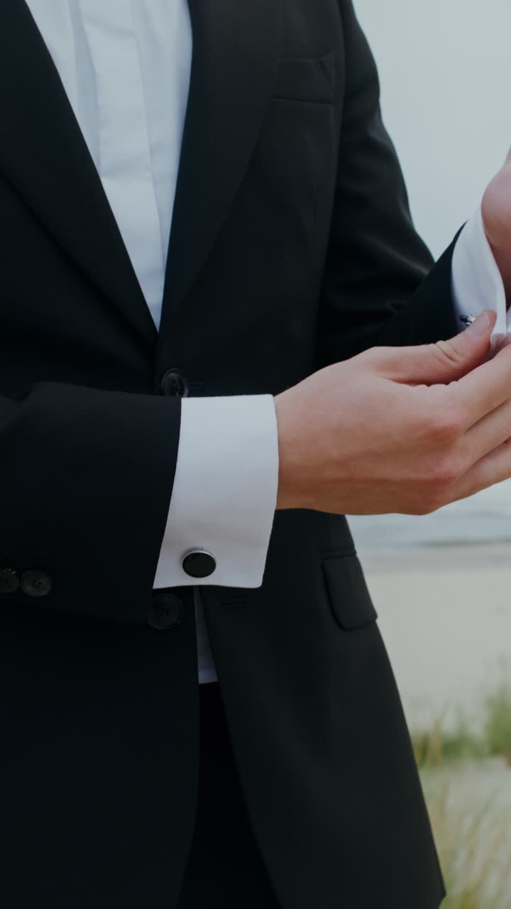 Groom in Black Suit on the Beach