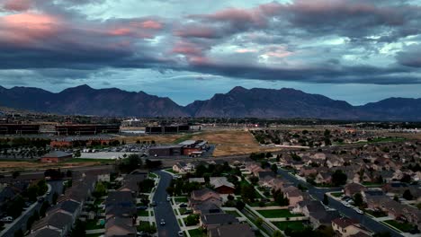 Lehi,-Utah-suburban-neighborhood-during-a-twilight-sunset---aerial-parallax-panorama