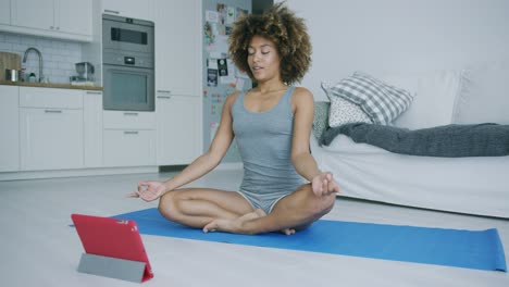 content woman meditating at home