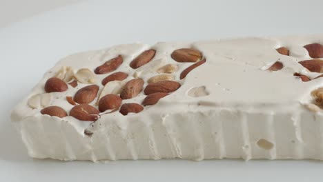 panning over nougat halva with almonds 4k footage