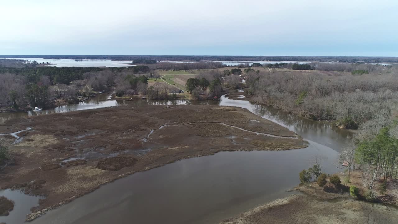 Drone flight from Bennetts Creek park in Suffolk Virginia West, showing the nearby Nansemond River and Willis Island in the distance