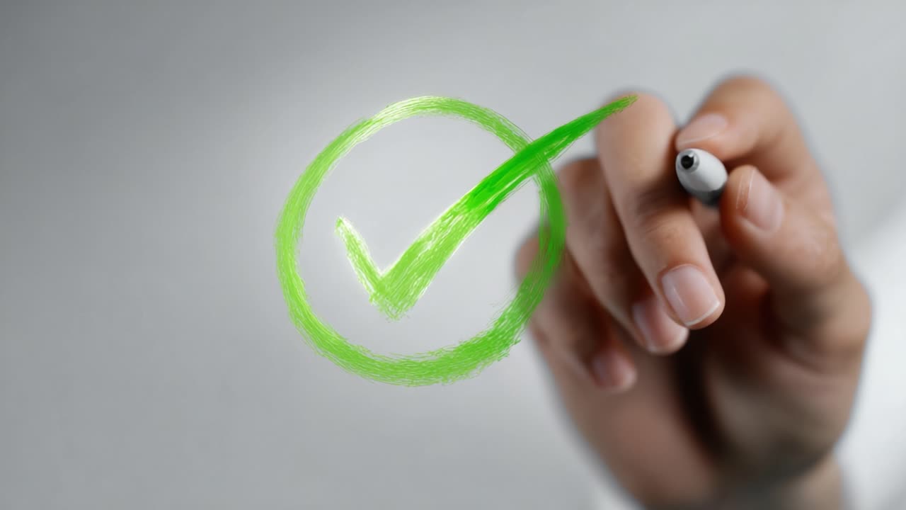 A hand drawing a vibrant green check mark inside a circle, symbolizing approval and positivity in a minimalist setting, conveys a sense of accomplishment and success