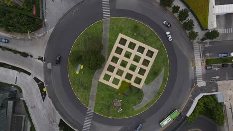 lift up aerial view of green roundabout santa fe mexico city with light traffic due to covid19 lockdown