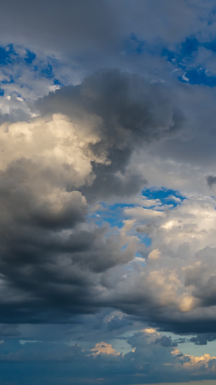 Soft sunset clouds drifting across a warm sky with gentle motion and calm evening atmosphere