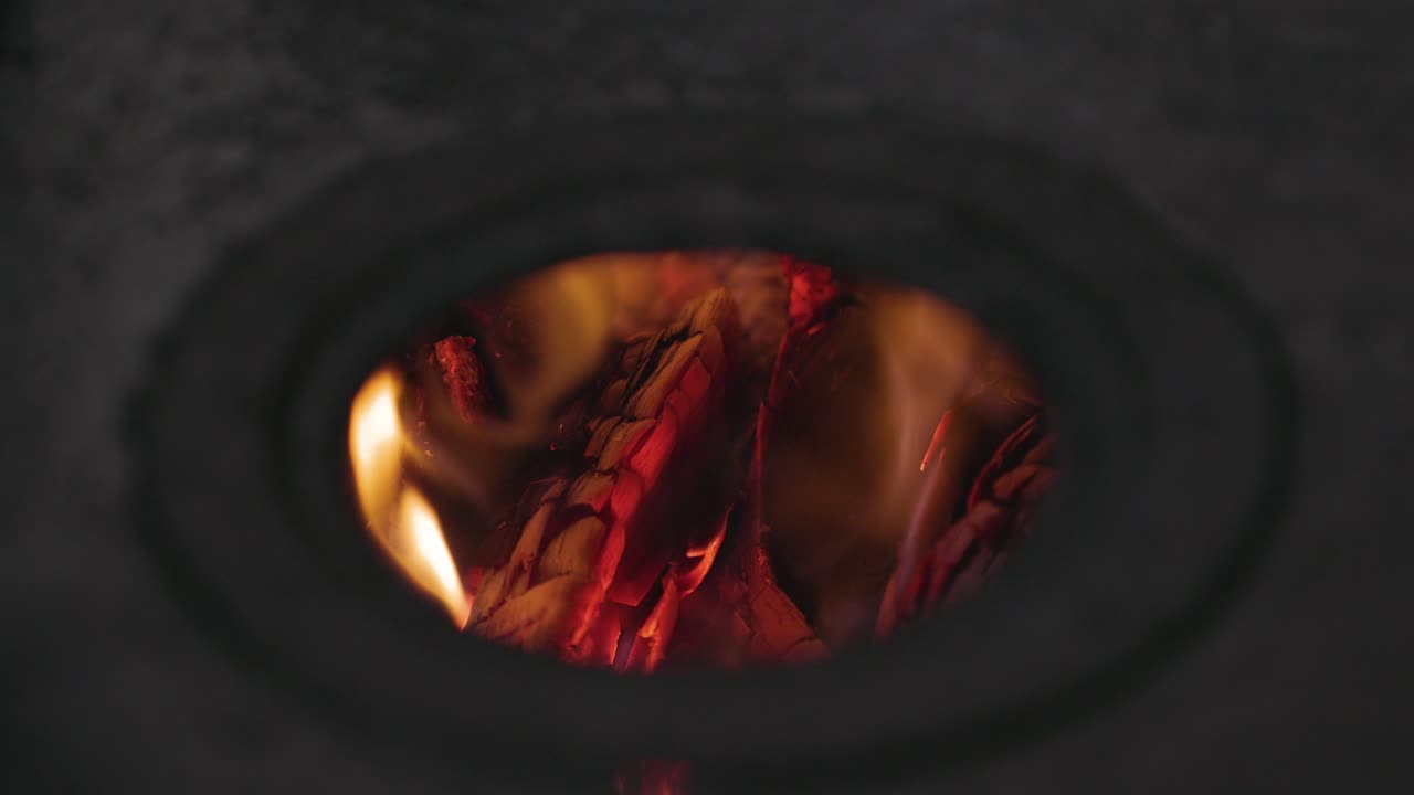 glowing, red woods, burning inside the stove - Static view