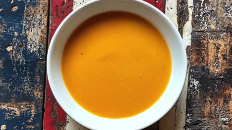 pumpkin soup in a white bowl