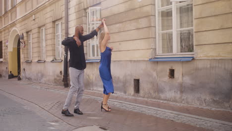 interracial couple dancing salsa in the old town street 5