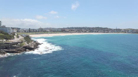 Panorama-Of-Bondi-BeachWith-Blue-Sea-And-Crashing-Waves---Ben-BucklerSuburb-Of-North-Bondi,-NSW,-Australia