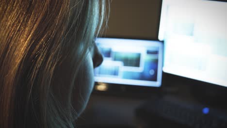 Woman-working-on-bright-screen-in-home-office