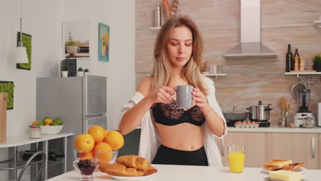 woman in lingerie enjoing coffee