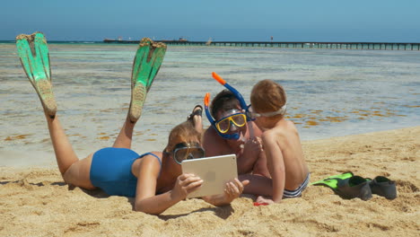 Family-Resting-on-the-Beach