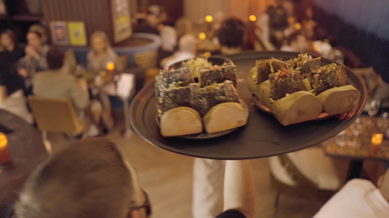 Waiter Serving Food in a Restaurant