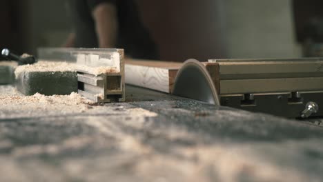 close-up of a circular saw blade while cutting wood in a joinery