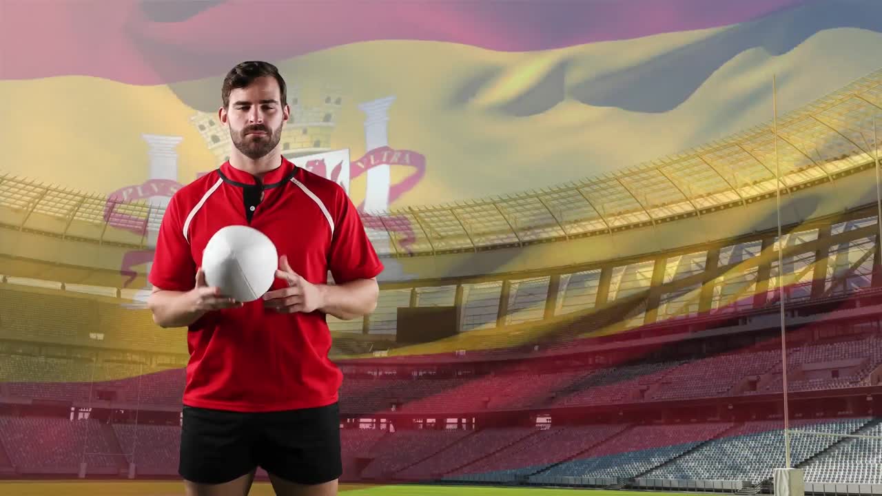 jugador de rugby profesional de pie frente a una bandera y un estadio