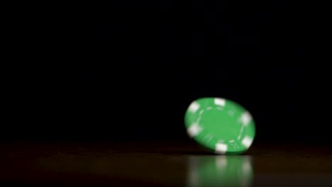 spinning green casino chip