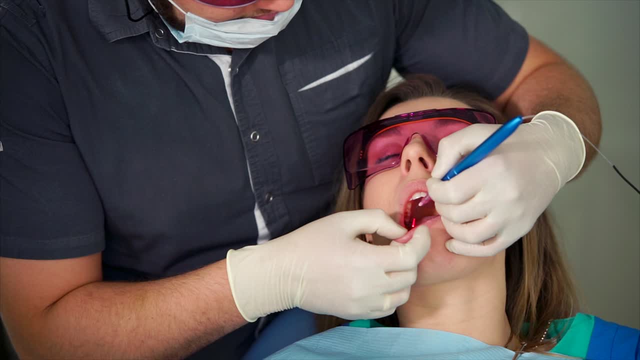 Dentist performing a dental procedure