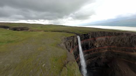 Diving-down-a-waterfall-around-volcanic-rocks