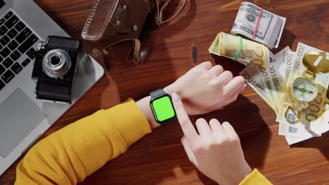 apple watch with green screen and money