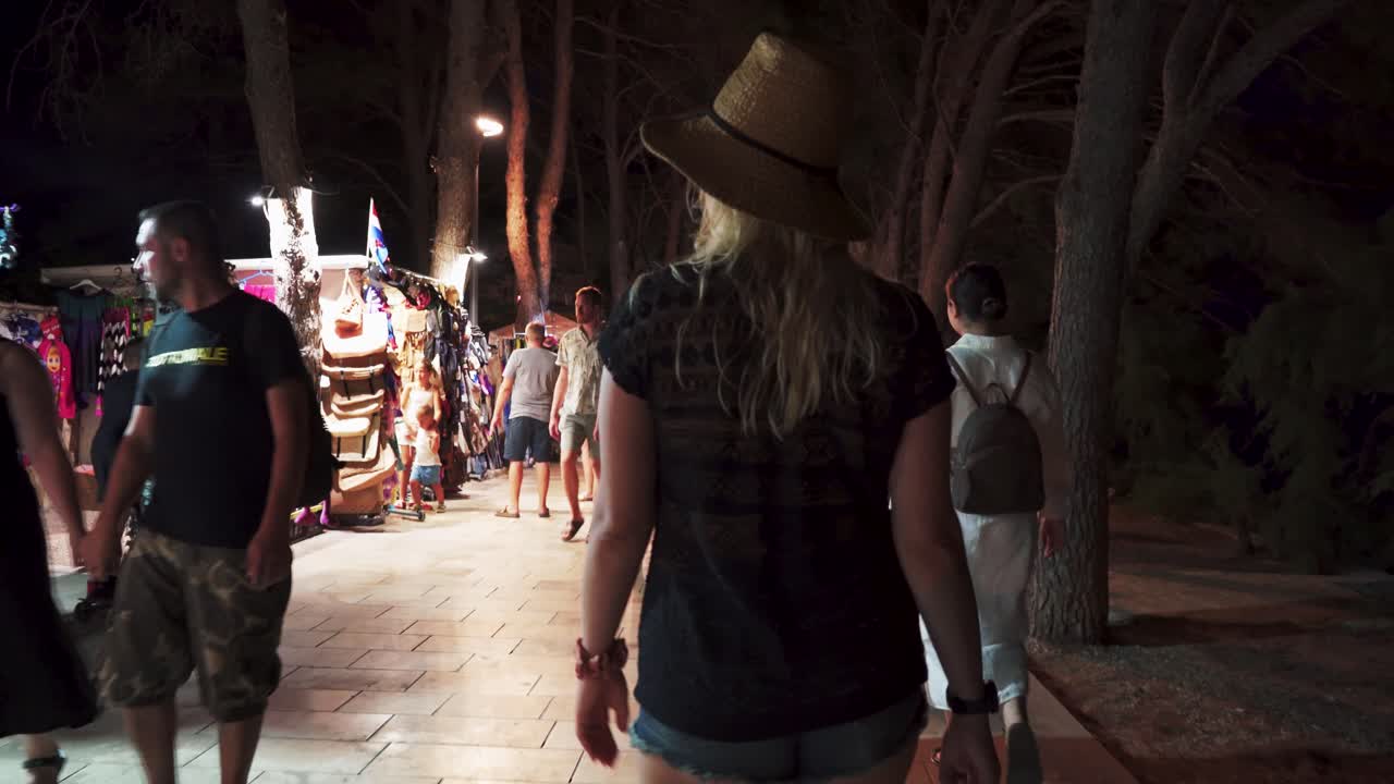 July 30, 2024 Bol, Croatia - Night Scene of Famous Torurist Resort Bol on Island Brac, Croatia Mediterranean Coastal Adriatic City of Bol. Tourists Zlatni Rat Beach Walkway to the City