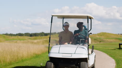 caucasian woman and african american man on the golf course.