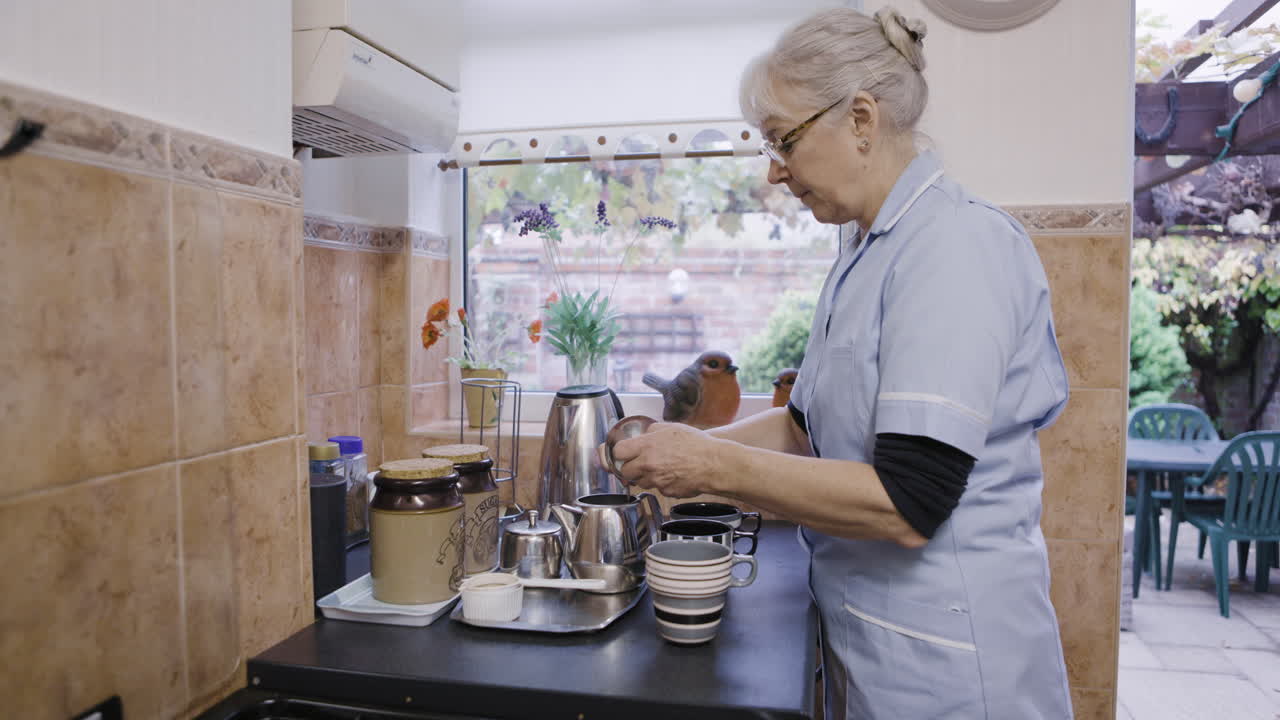 Woman preparing tea in a kitchen