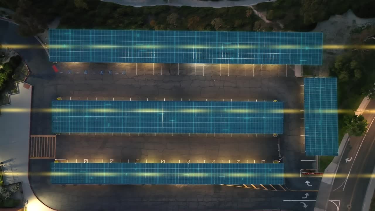 Solar cells using generated power to charge cars and to illuminate a parking canopy, aerial of VFX graphic overlay