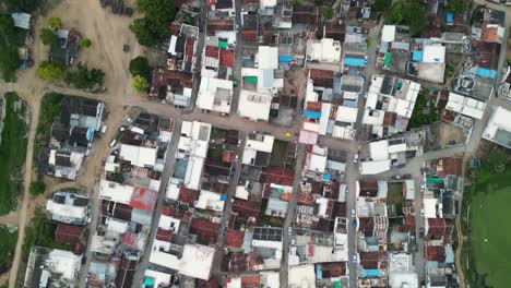 Top-Down-shot-of-a-Indian-Village,-with-old-and-new-houses,-with-small-road-and-vintage-vibes,-Gujrat-village,-rural-development