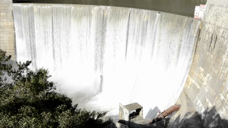 Tilt-down-shot-of-Matilija-Creek-spilling-over-the-obsolete-Matilija-Dam-after-a-spring-storm-near-Ojai-California