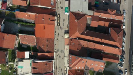 ivanjica, serbia, birdseye aerial view, downtown pedestrian street and buildings on sunny summer day, top down drone shot