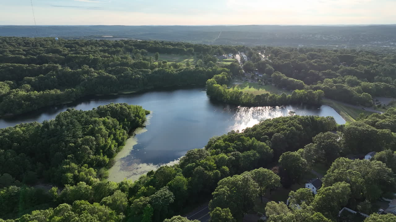 Lake Surrounded With Lush Green Vegetation In New Haven, Connecticut - Drone Shot