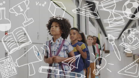 animation of school items icons over diverse schoolchildren standing in corridor at school