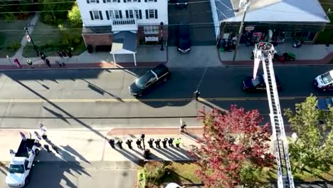 drone following hearse at funeral procession