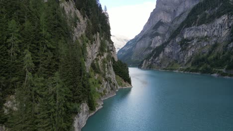 bird view of dramatic pass through between two gigantic mountains and wide vibrant river in the rarest form of nature in the middle of nowhere hidden from general population uncovered heaven on earth