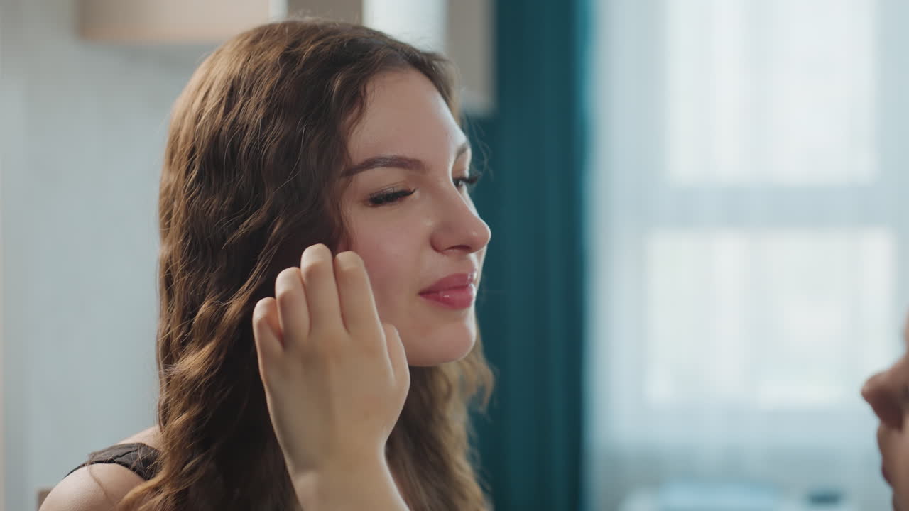 Serene Woman Carefully Brushing Hair Prior To Camera Test And Makeup Application, Tranquil Female Preparing Her Hair For Upcoming Portrait Sitting With Gentle Natural Lighting And Grooming